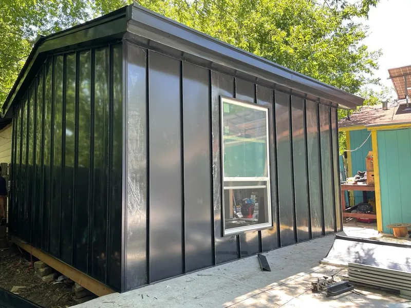 Black standing seam metal wall panels for Metal Roof Installation in Mead